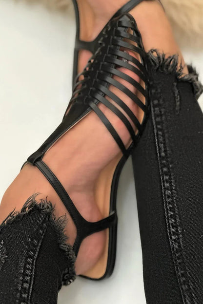 sandales noires décontractées à bride en T, découpes et bout effilé.