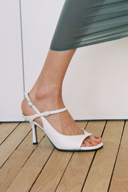 stiletto noirs slingback à bout ouvert et imprimé python.