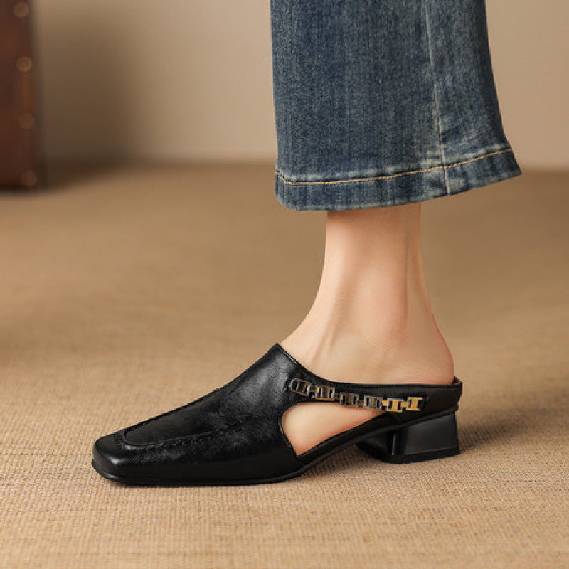Vyla mules en cuir noir
